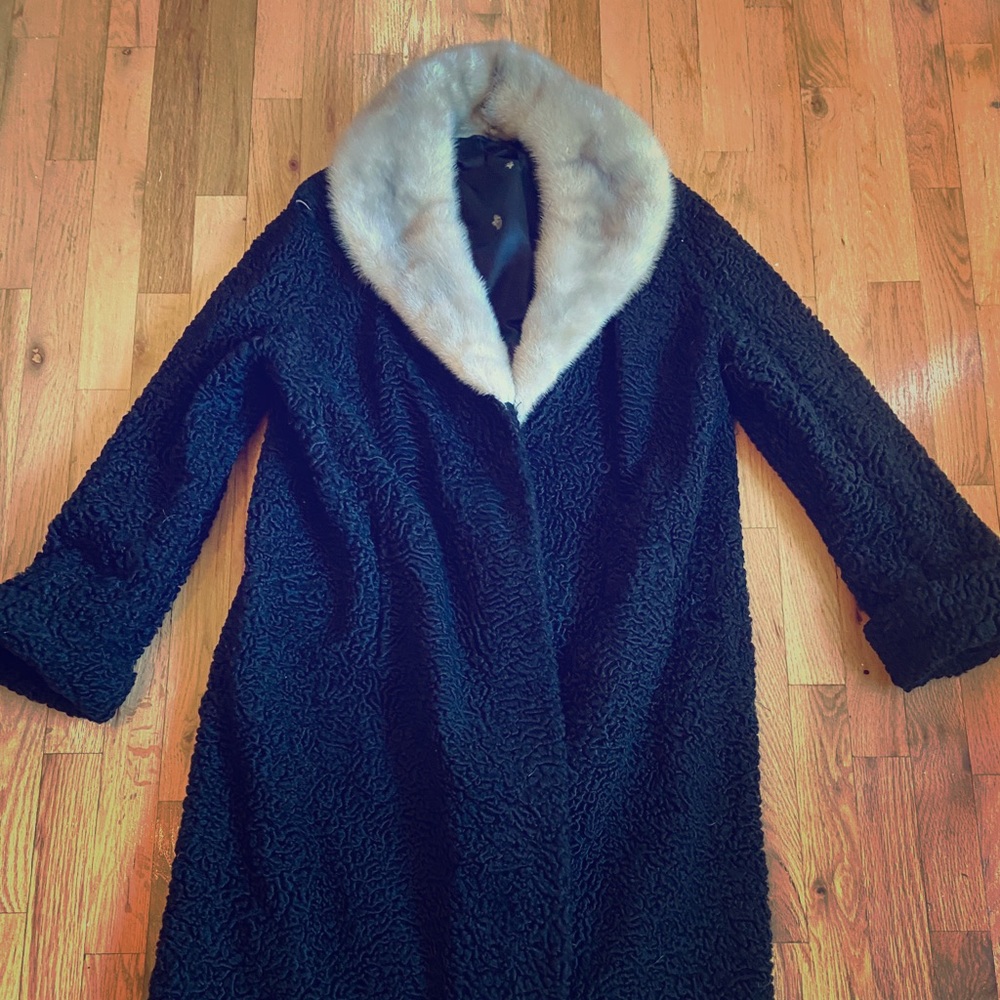 A custom made black vintage fur coat.